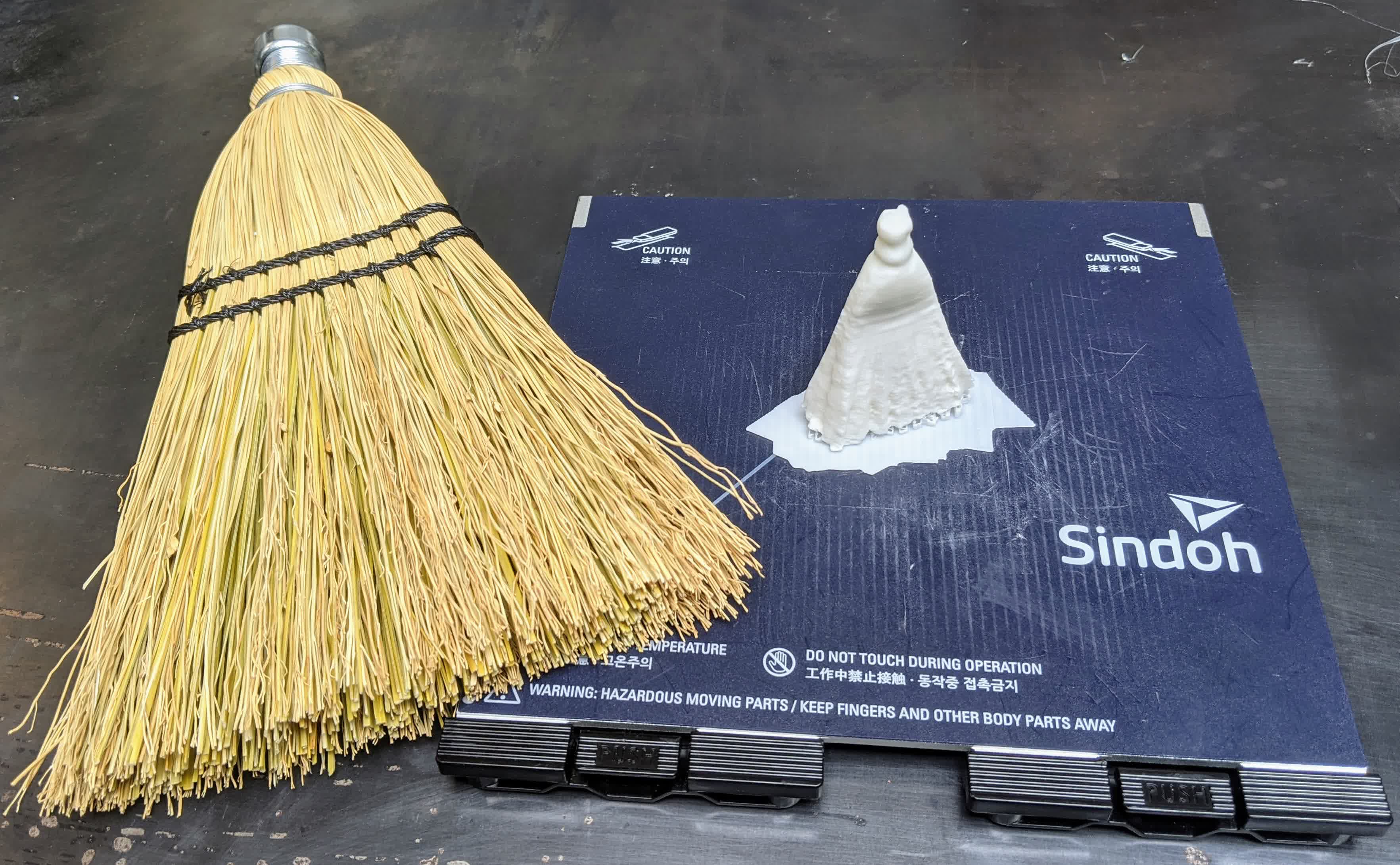 Broom print and support with broom